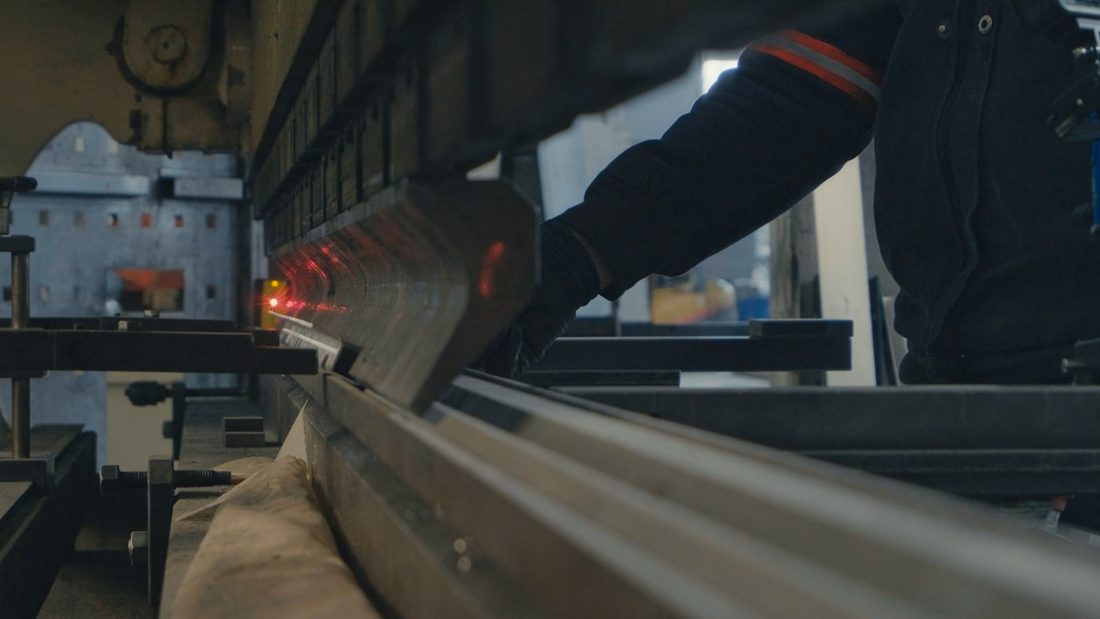 Engineer performing maintenance on an installed production line